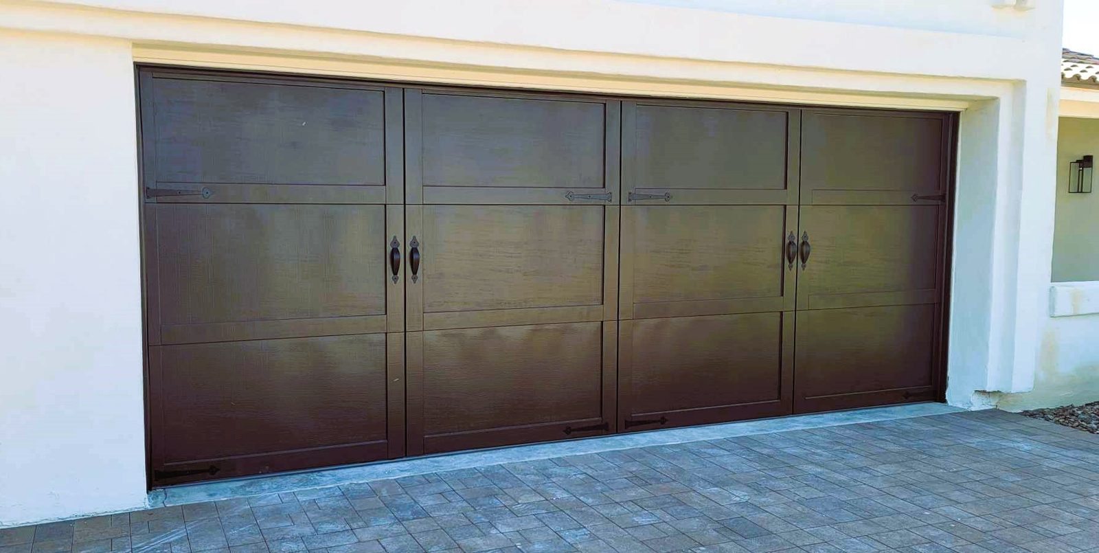 Walnut carriage house garage door on a tile roof Arizona home